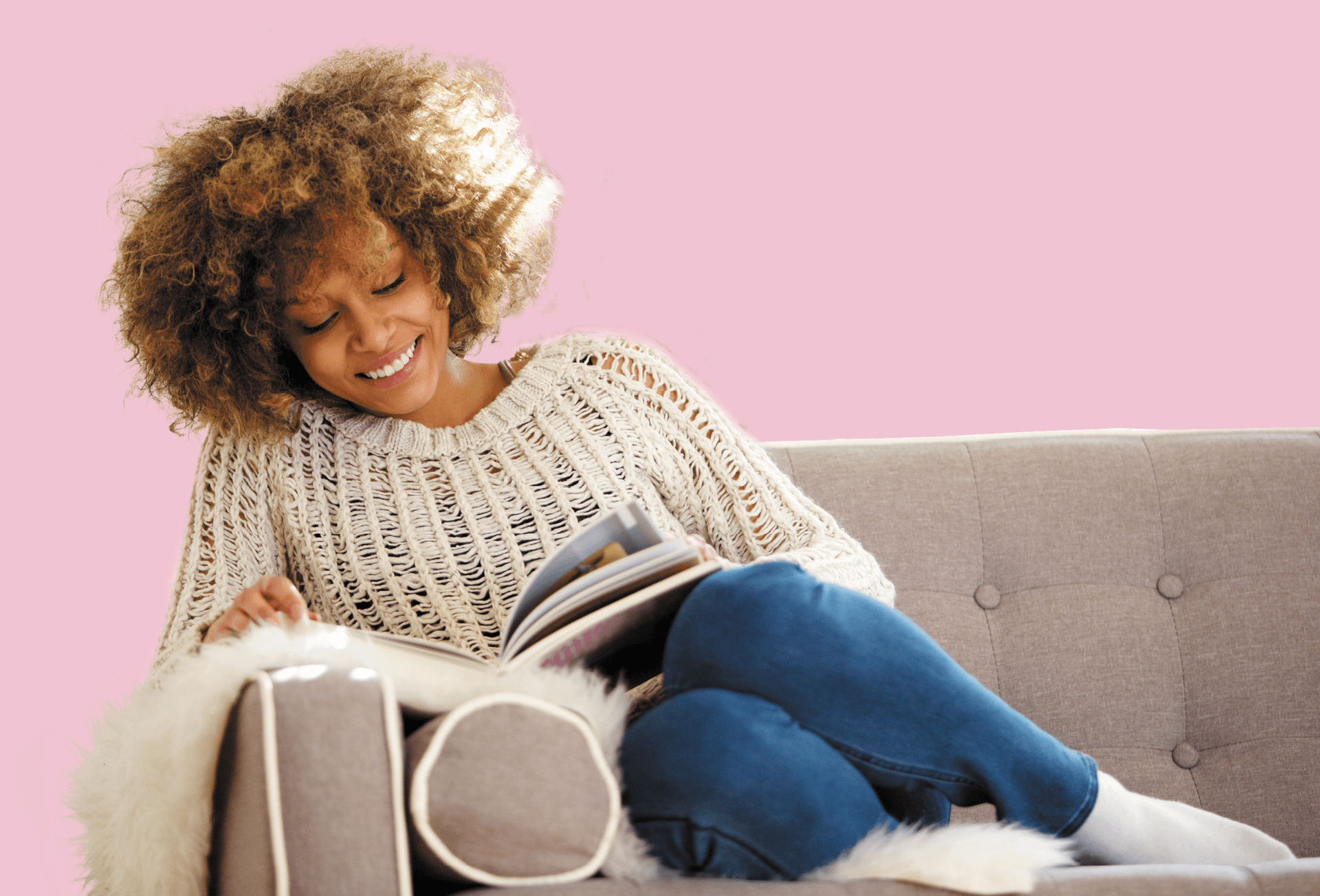 Lady reading on the sofa for her mental health