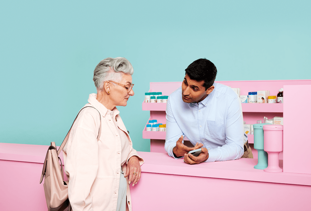 Pharmacist helping customer with Hey Pharmacist