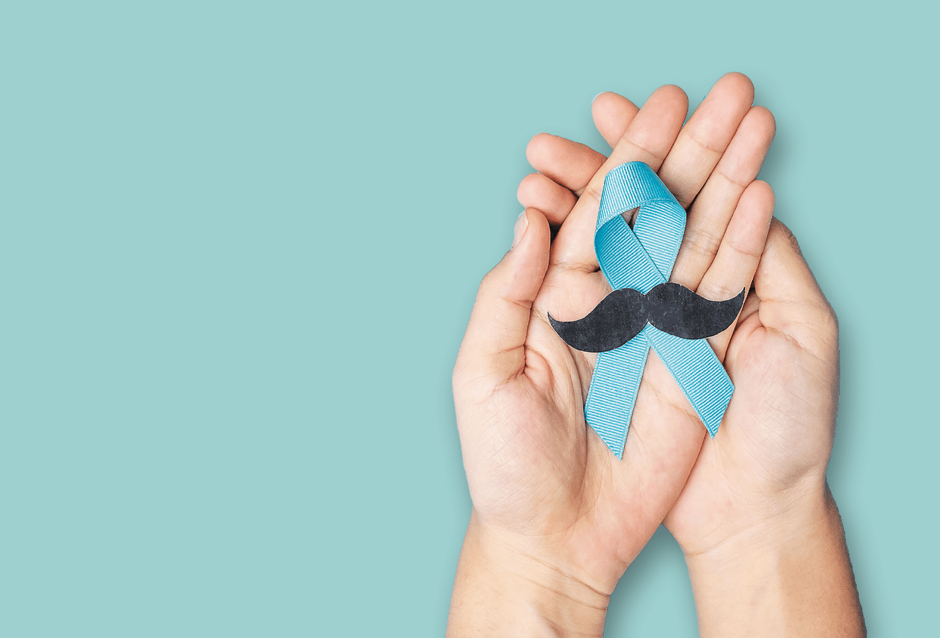Hands holding the blue Movember ribbon with a moustache on it