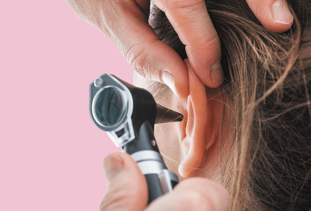 Woman getting her ear health checked