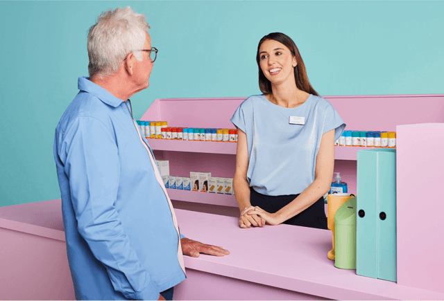 Patient and pharmacist at pharmacy
